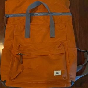 Beautiful burnt orange ORI backpack. Used 1 time. Will fit a small laptop.
